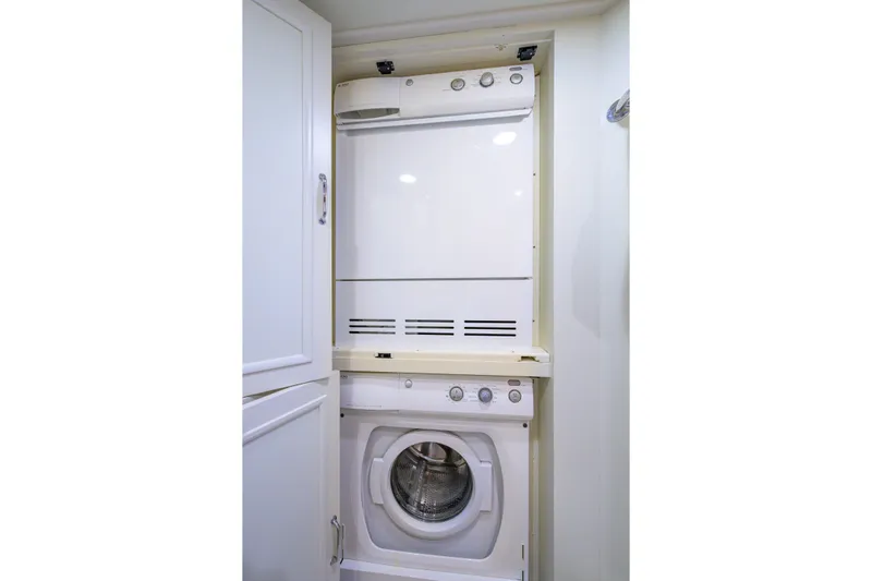 Monkey Business Yacht Photos Pics Stacked washer and dryer in 2007 Grand Banks 59 Aleutian RP yacht.