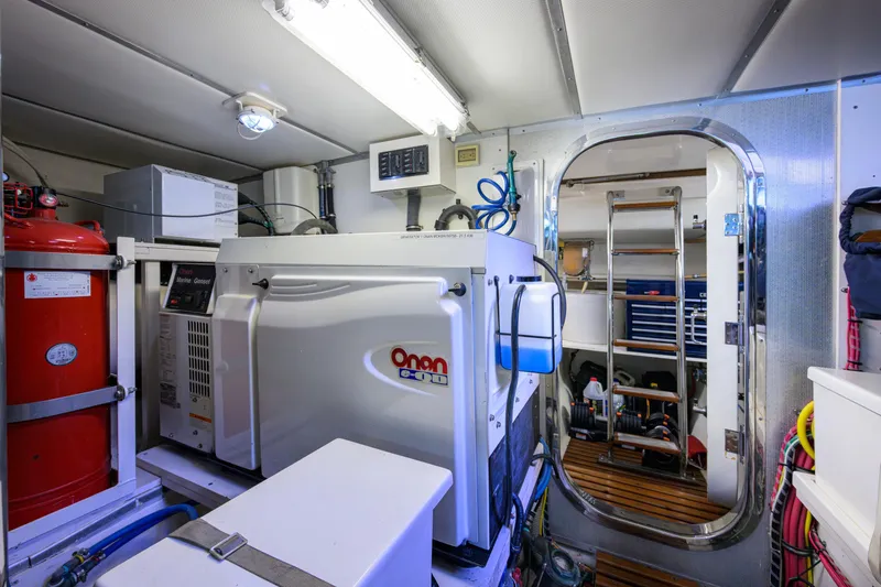 Monkey Business Yacht Photos Pics Engine room of 2007 Grand Banks 59 Aleutian RP with Onan marine generator.