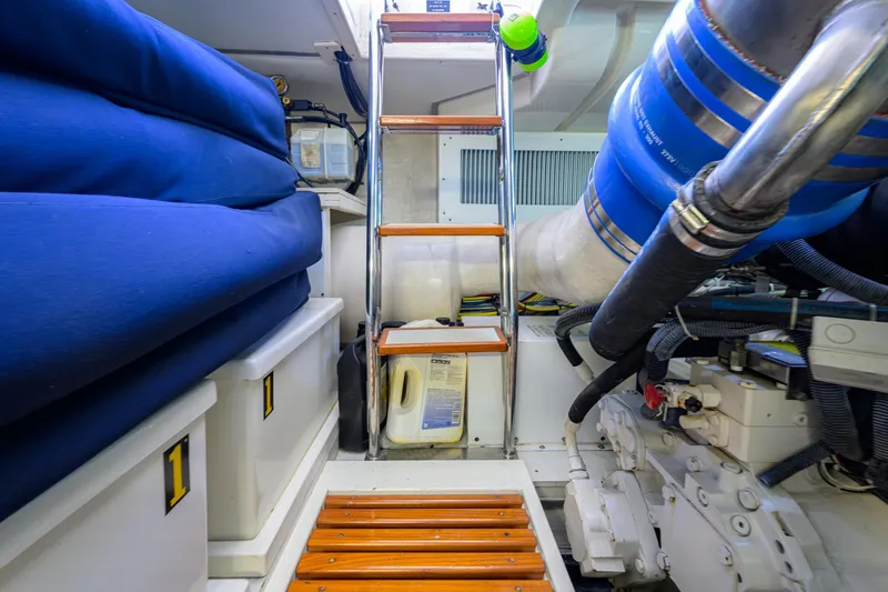 Monkey Business Yacht Photos Pics Engine room of 2007 Grand Banks 59 Aleutian RP yacht with storage and machinery.