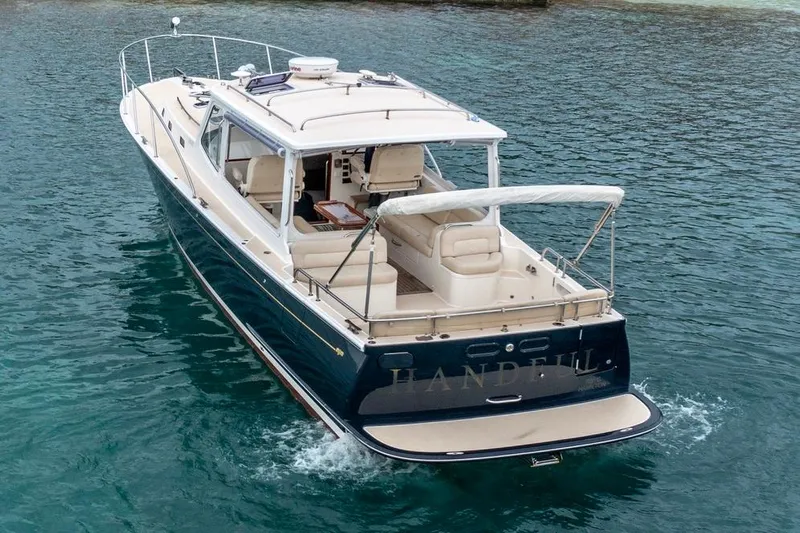 Handful Yacht Photos Pics 2014 MJM 40z yacht cruising on clear blue water.