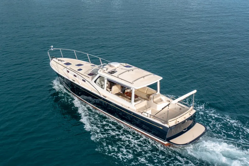 Handful Yacht Photos Pics 2014 MJM 40z yacht cruising on open water, aerial view.