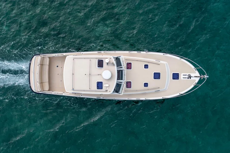 Handful Yacht Photos Pics Aerial view of 2014 MJM 40z yacht cruising on clear blue water.