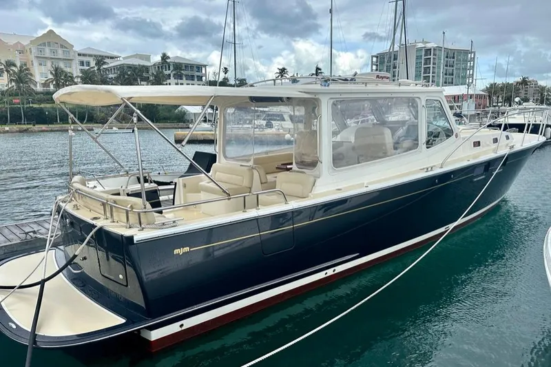 Handful Yacht Photos Pics 2014 MJM 40z yacht docked in marina, featuring sleek design and spacious interior.