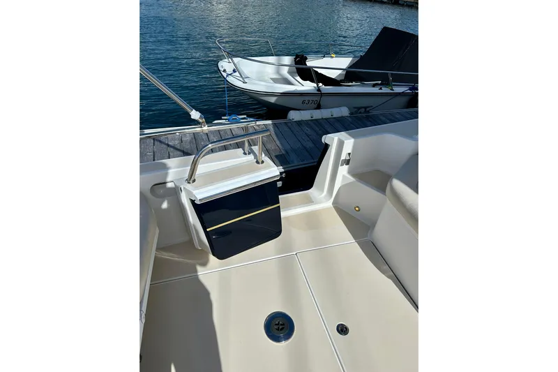 Handful Yacht Photos Pics 2014 MJM 40z boat interior with docked small boat in background.
