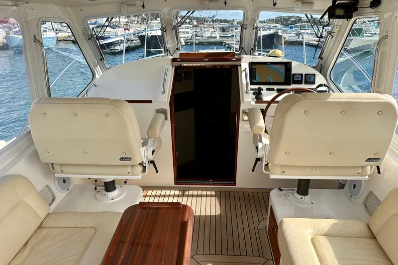 Handful Yacht Photos Pics Interior of 2014 MJM 40z yacht with helm, seating, and navigation equipment.