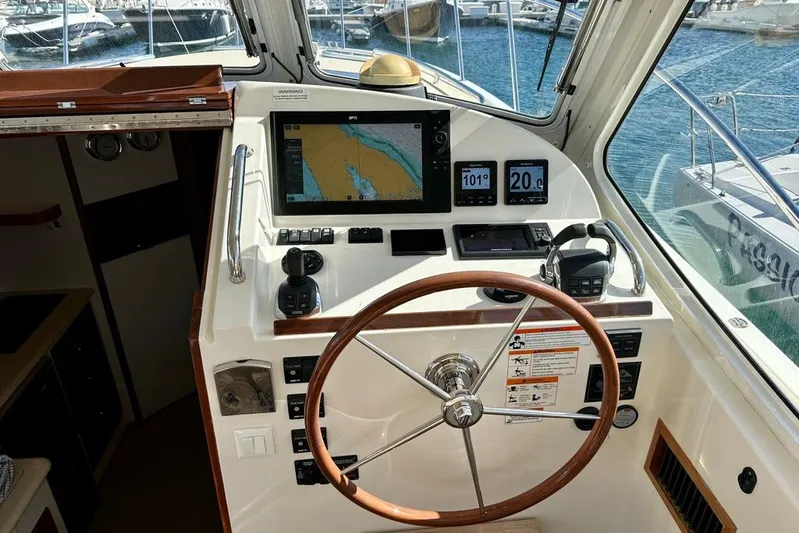 Handful Yacht Photos Pics Cockpit of 2014 MJM 40z yacht with navigation equipment and steering wheel.