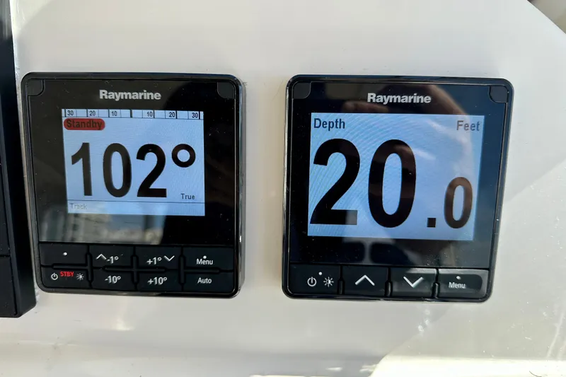 Handful Yacht Photos Pics Raymarine navigation displays showing 102&deg; heading and 20 feet depth on MJM 40z, 2014 model.