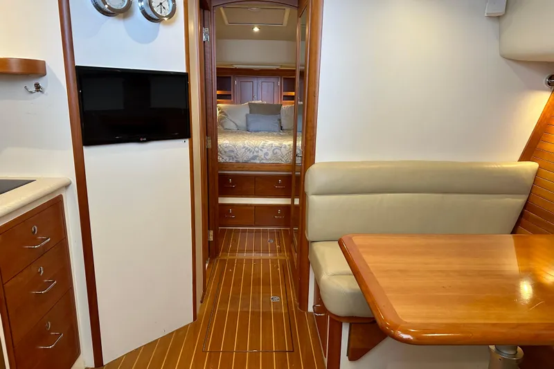 Handful Yacht Photos Pics Interior of 2014 MJM 40z yacht with cozy seating and elegant wood finishes.