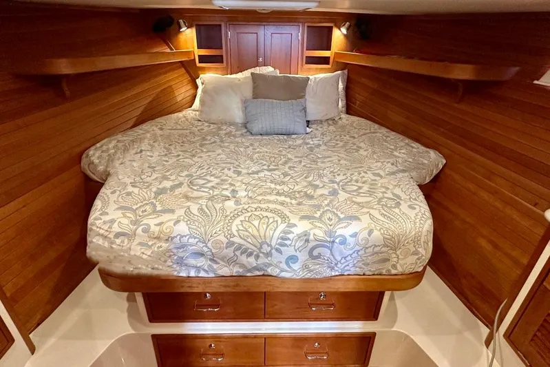 Handful Yacht Photos Pics Luxurious cabin interior of 2014 MJM 40z yacht with elegant bedding and wooden finish.