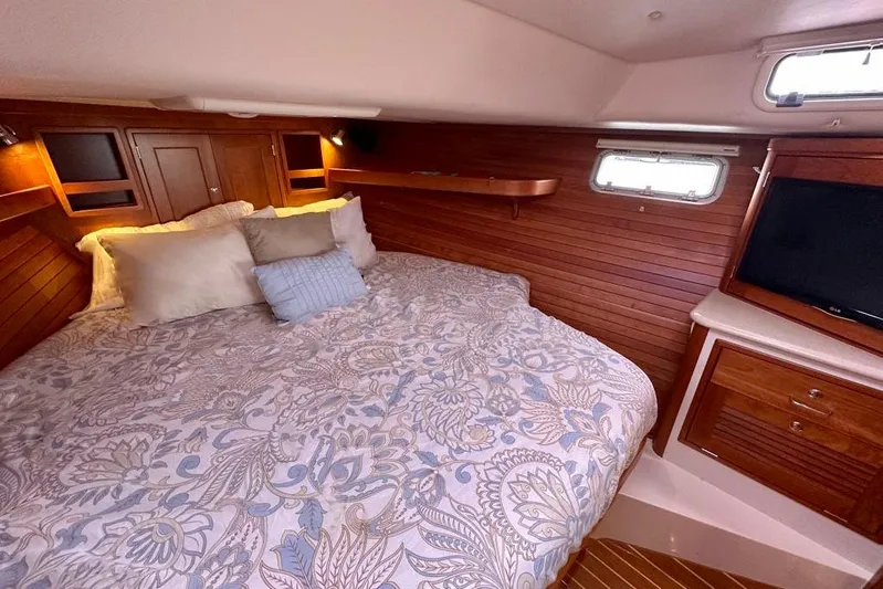 Handful Yacht Photos Pics Luxurious cabin interior of 2014 MJM 40z yacht with cozy bedding and wooden accents.