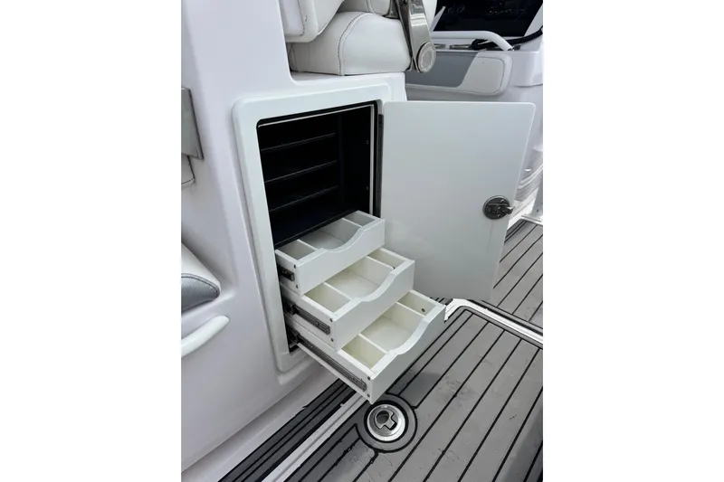  Yacht Photos Pics 2018 Fountain 34 Center Console boat with open storage drawers on deck.
