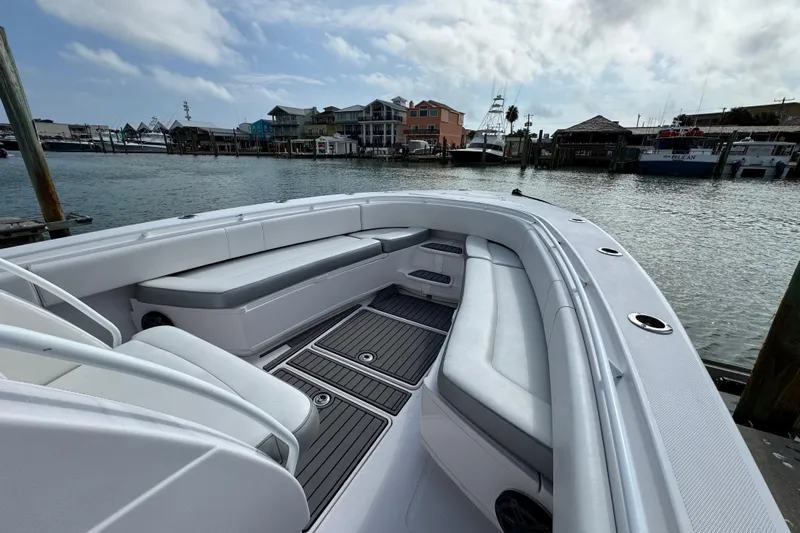  Yacht Photos Pics 2018 Fountain 34 Center Console boat with spacious seating, docked at a marina.