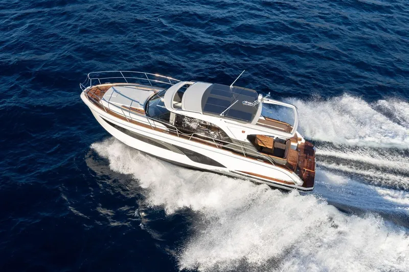  Yacht Photos Pics 2026 Marex 390 yacht cruising on open blue sea, showcasing sleek design and performance.