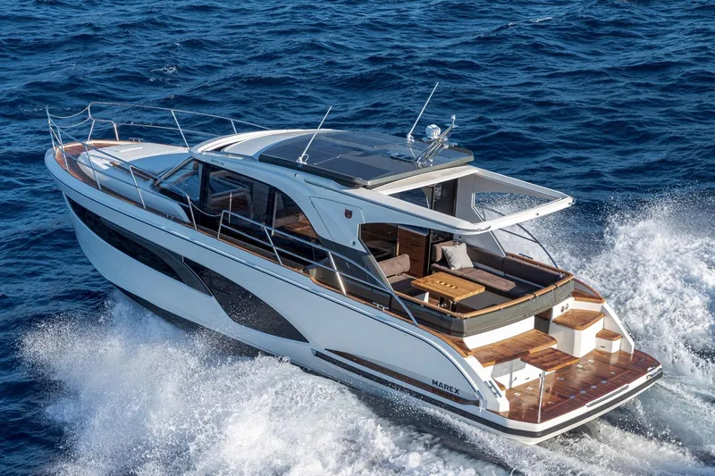  Yacht Photos Pics 2026 Marex 390 yacht cruising on open sea, showcasing sleek design and luxury features.
