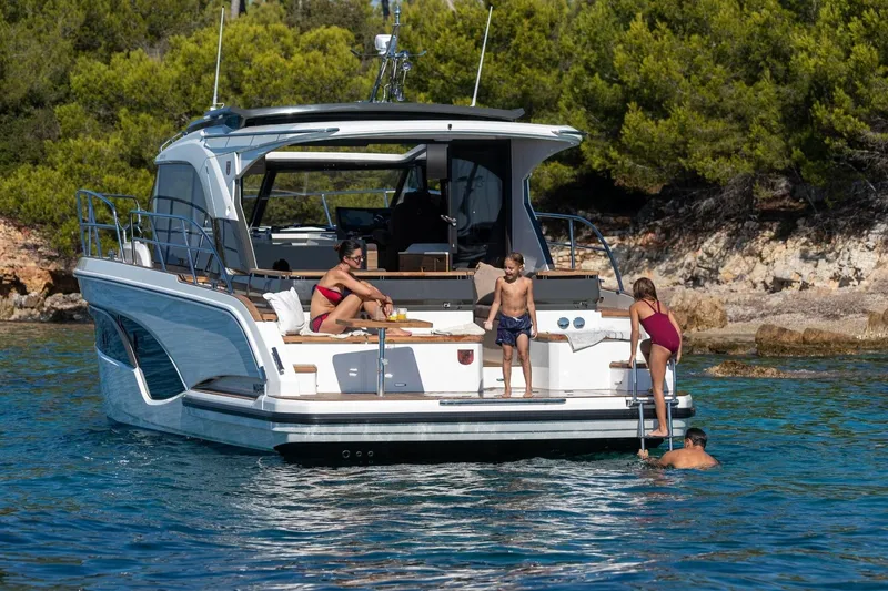  Yacht Photos Pics 2026 Marex 390 yacht with people enjoying a sunny day on the water.