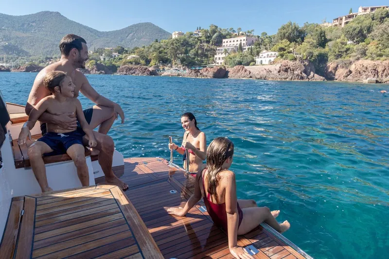  Yacht Photos Pics Family enjoying a day on a 2026 Marex 390 yacht by the sea.