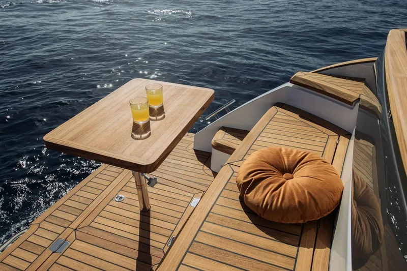  Yacht Photos Pics Luxurious Marex 390 yacht deck with wooden table, cushions, and ocean view, 2026 model.
