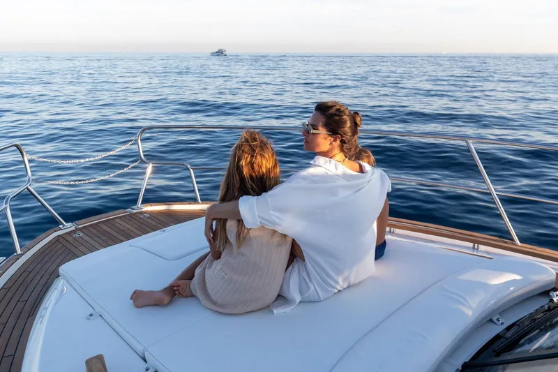  Yacht Photos Pics Two people relaxing on a 2026 Marex 390 yacht, enjoying the serene ocean view.