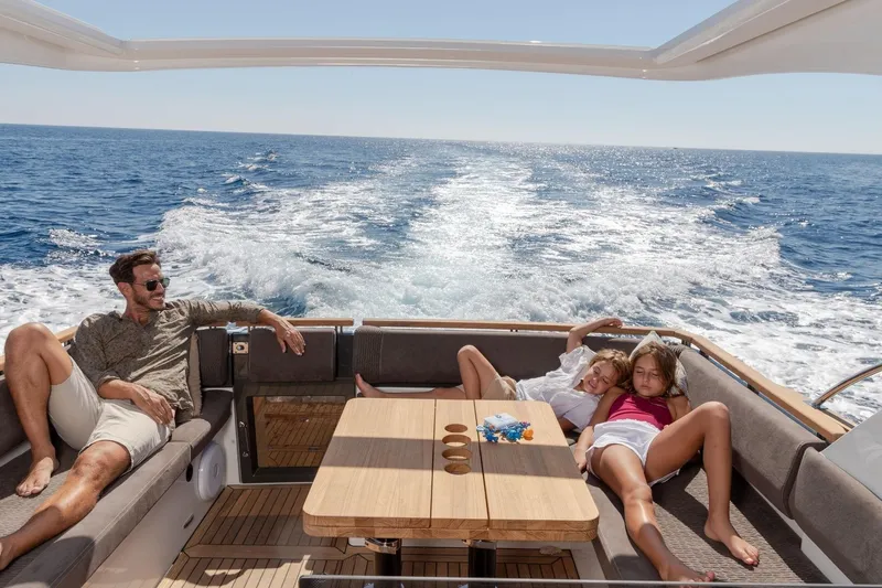  Yacht Photos Pics Family relaxing on a 2026 Marex 390 yacht, enjoying a sunny day at sea.