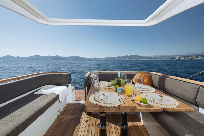  Yacht Photos Pics Luxurious Marex 390 yacht dining area with ocean view, set for a meal, 2026 model.