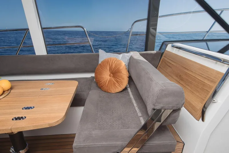  Yacht Photos Pics Luxurious interior of 2026 Marex 390 yacht with plush seating and ocean view.