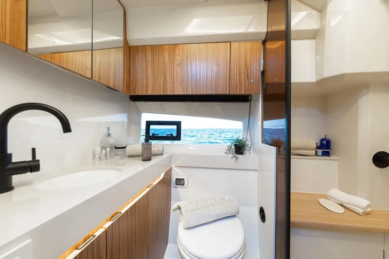  Yacht Photos Pics Luxurious Marex 390 yacht bathroom interior, featuring modern fixtures and ocean view, 2026 model.