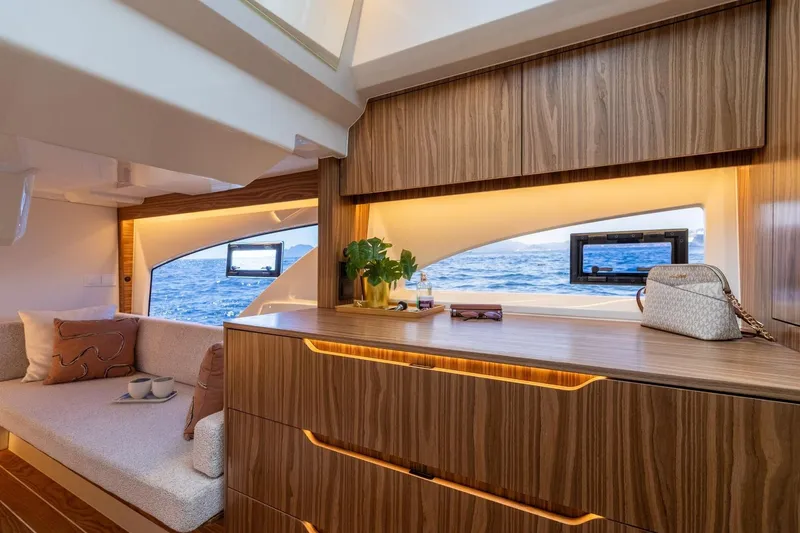  Yacht Photos Pics Luxurious Marex 390 yacht interior, featuring elegant wood cabinetry and ocean view windows, 2026 model.