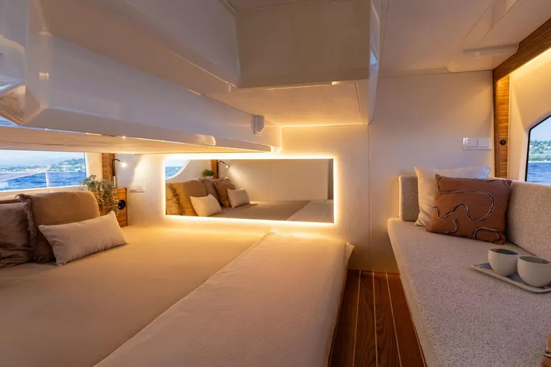  Yacht Photos Pics Luxurious interior of 2026 Marex 390 yacht with cozy seating and ambient lighting.