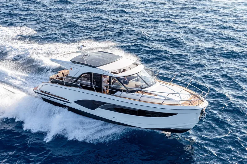  Yacht Photos Pics 2026 Marex 390 yacht cruising on open sea, showcasing sleek design and luxury features.