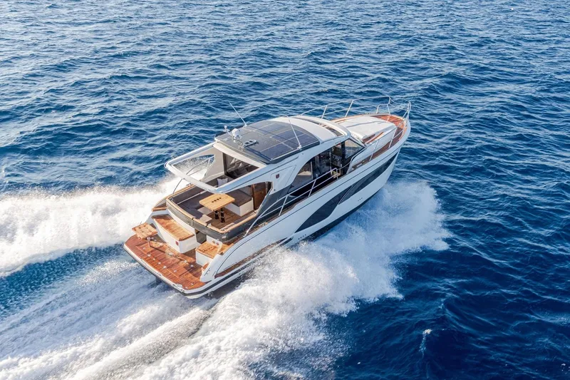  Yacht Photos Pics 2026 Marex 390 yacht cruising on open blue sea, showcasing sleek design and luxury.