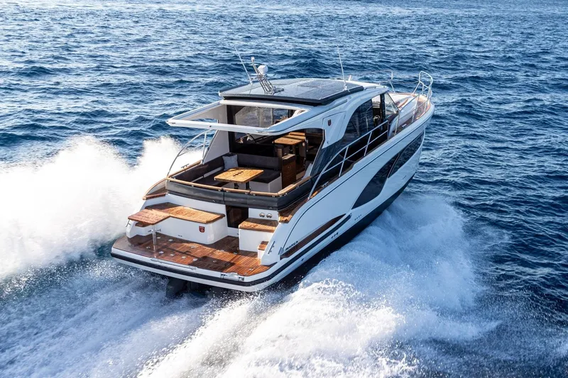  Yacht Photos Pics 2026 Marex 390 yacht cruising on open sea, showcasing sleek design and luxury features.