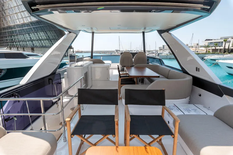  Yacht Photos Pics Luxurious 2024 Azimut 68 yacht interior with elegant seating and dining area.