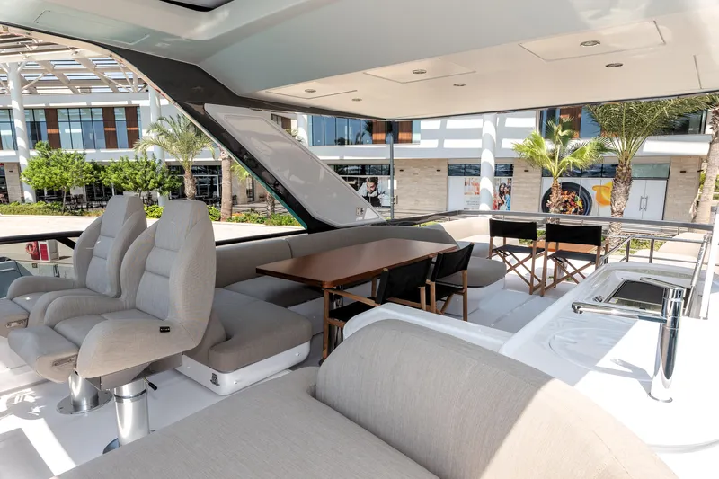  Yacht Photos Pics Luxurious 2024 Azimut 68 yacht interior with plush seating and dining area.