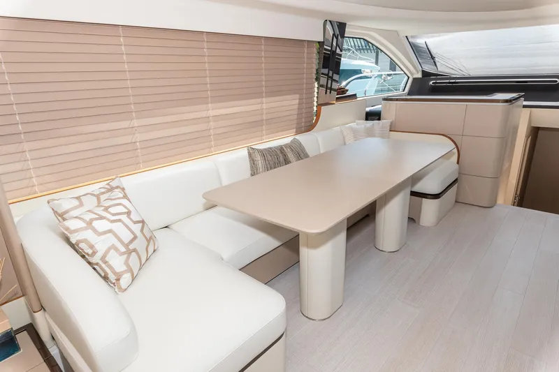  Yacht Photos Pics Luxurious interior of 2024 Azimut 68 yacht with elegant seating and dining area.