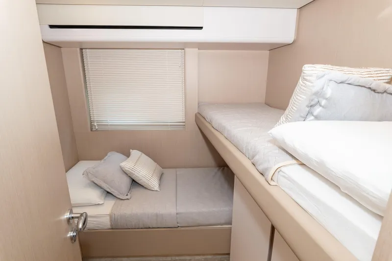  Yacht Photos Pics 2024 Azimut 68 yacht cabin with bunk beds and modern decor.