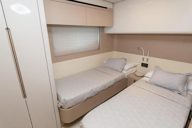  Yacht Photos Pics 2024 Azimut 68 yacht cabin with twin beds, modern design, and neutral tones.