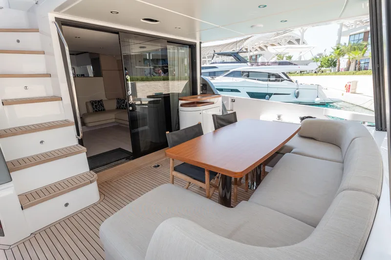  Yacht Photos Pics Luxurious 2024 Azimut 68 yacht interior with elegant seating and dining area.