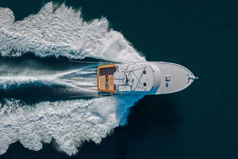 Chunda Yacht Photos Pics Aerial view of 1998 Merritt 48 yacht cruising on open water.