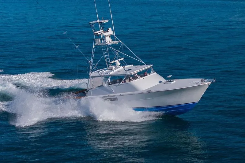 Chunda Yacht Photos Pics 1998 Merritt 48 yacht cruising on open blue sea.