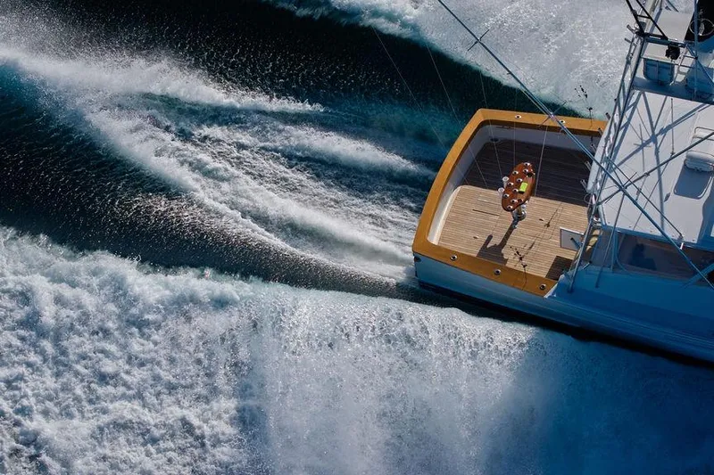 Chunda Yacht Photos Pics Aerial view of 1998 Merritt 48 yacht cruising through ocean waves.