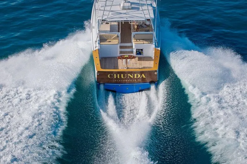 Chunda Yacht Photos Pics Aerial view of 1998 Merritt 48 yacht "Chunda" cruising through blue ocean waters.