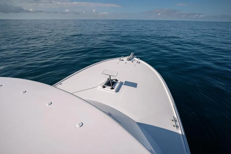 Chunda Yacht Photos Pics Bow of a 1998 Merritt 48 yacht on calm ocean waters.