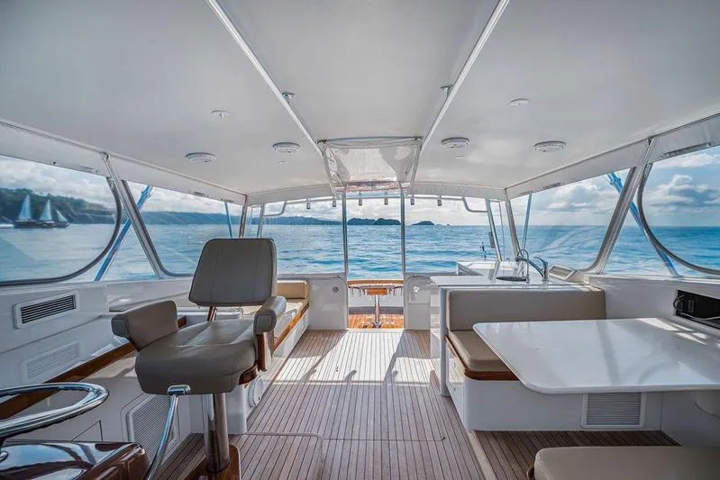 Chunda Yacht Photos Pics Luxurious interior of 1998 Merritt 48 yacht with ocean view and comfortable seating.