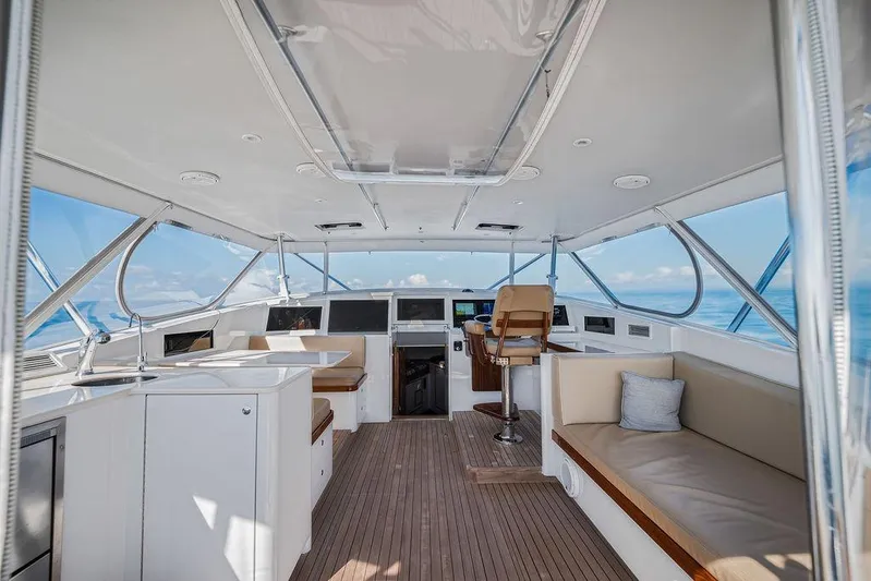 Chunda Yacht Photos Pics Luxurious 1998 Merritt 48 yacht interior with modern helm and comfortable seating.