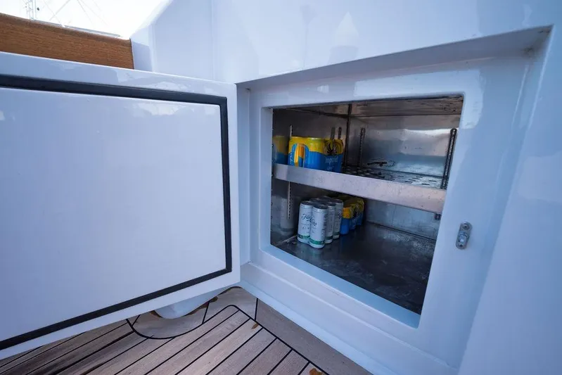 Chunda Yacht Photos Pics Open storage compartment on 1998 Merritt 48 yacht with drinks inside.