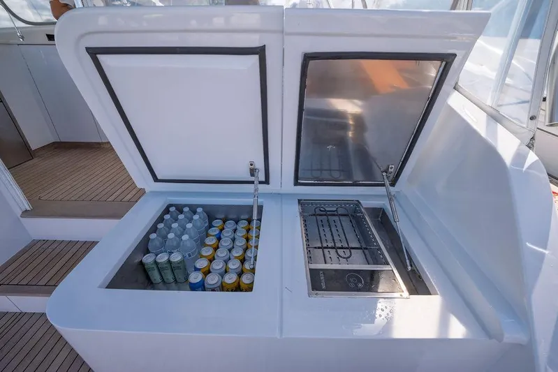 Chunda Yacht Photos Pics Built-in cooler and grill on a 1998 Merritt 48 yacht, stocked with drinks.