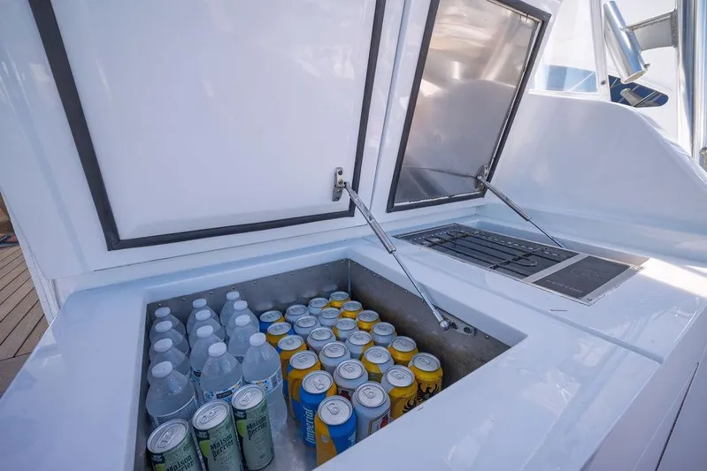 Chunda Yacht Photos Pics Built-in cooler on 1998 Merritt 48 yacht, stocked with drinks and water bottles.
