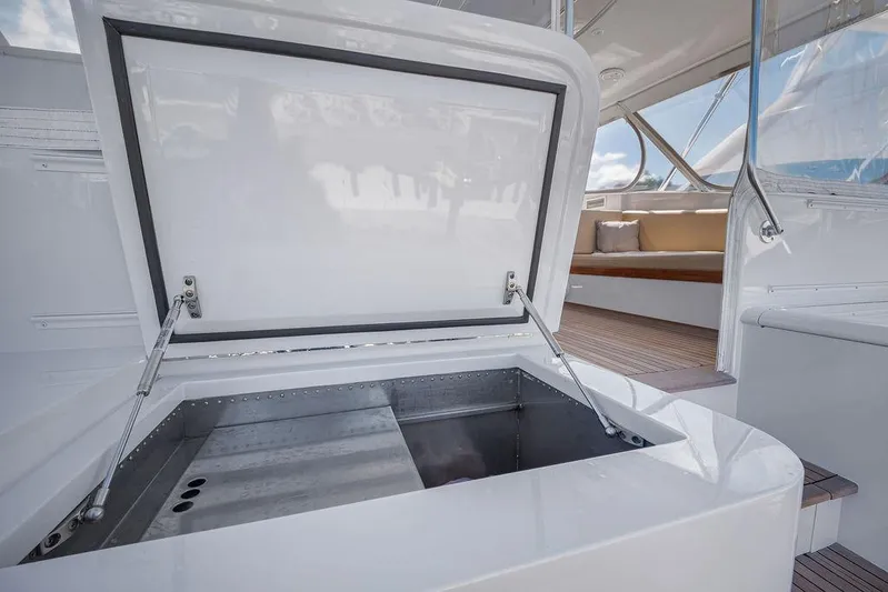 Chunda Yacht Photos Pics Open storage compartment on a 1998 Merritt 48 yacht, showcasing sleek interior design.