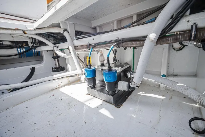 Chunda Yacht Photos Pics Engine room of 1998 Merritt 48 boat with visible wiring and components.