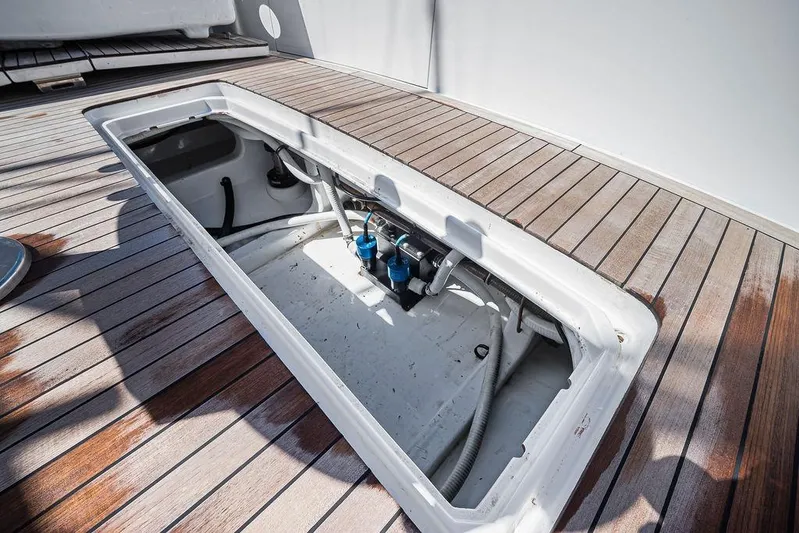 Chunda Yacht Photos Pics Open hatch on Merritt 48 yacht deck, showcasing interior components, 1998 model.